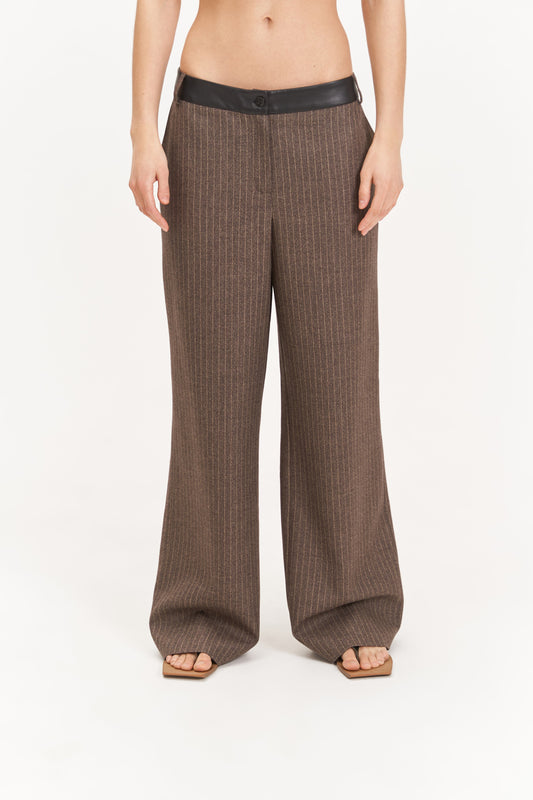 Striped trousers with a leather belt