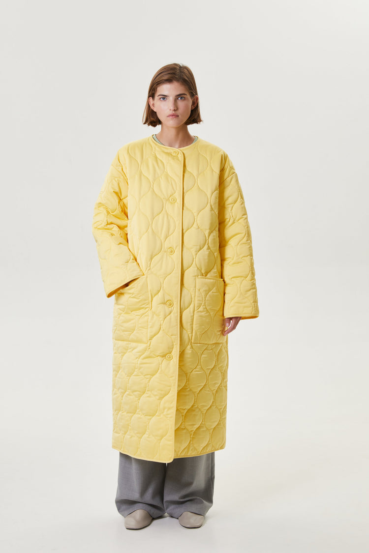 Yellow quilted coat
