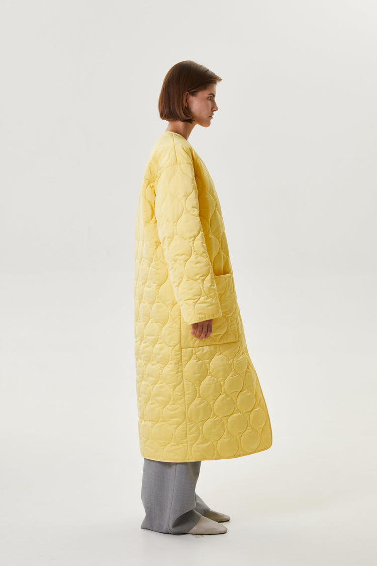 Yellow quilted coat